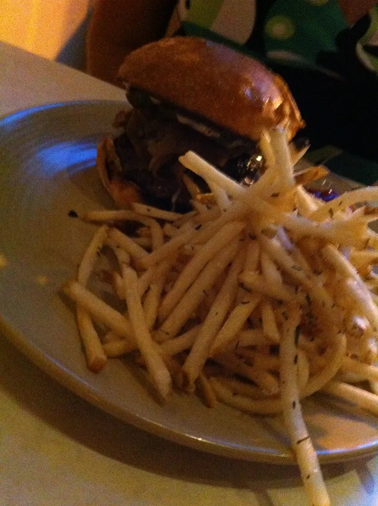 [NEEDS ORIGINAL] Burger with shoestring fries — illustrates frita cubana with fries on Cuban bread, El Mago de las Fritas, alt: Cuban frita shoestring fries Cuban bread Miami