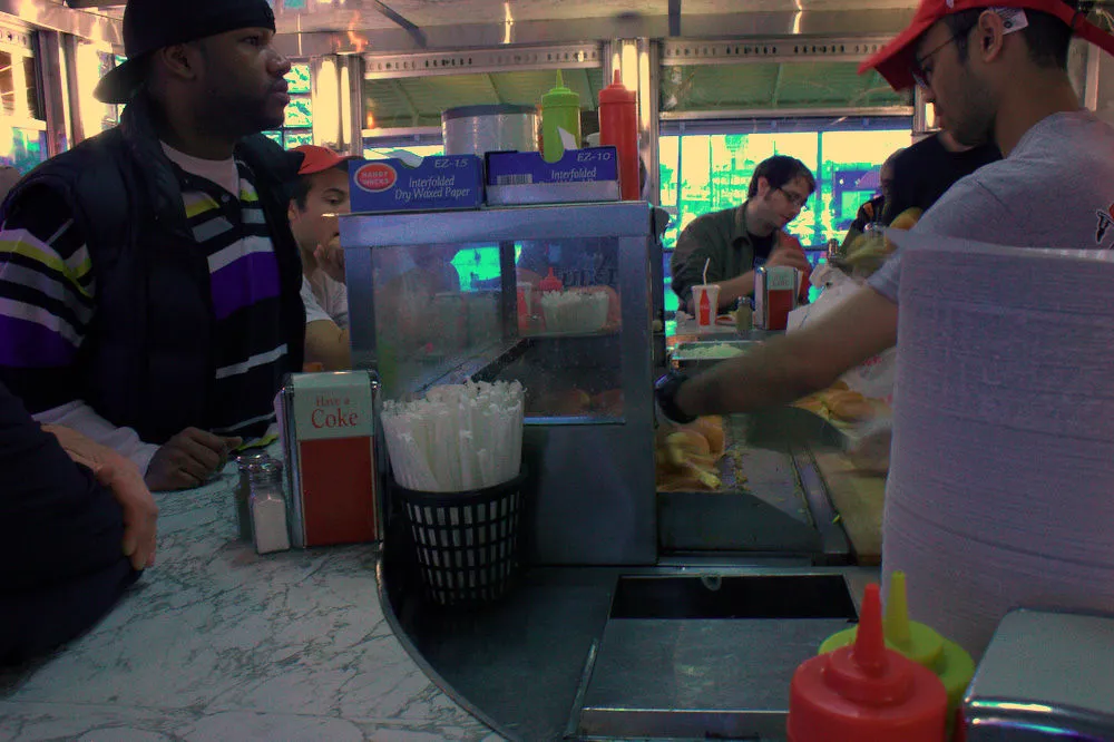 Diner counter with burgers — Chug’s Diner Coconut Grove atmosphere, alt: Coconut Grove diner burger counter