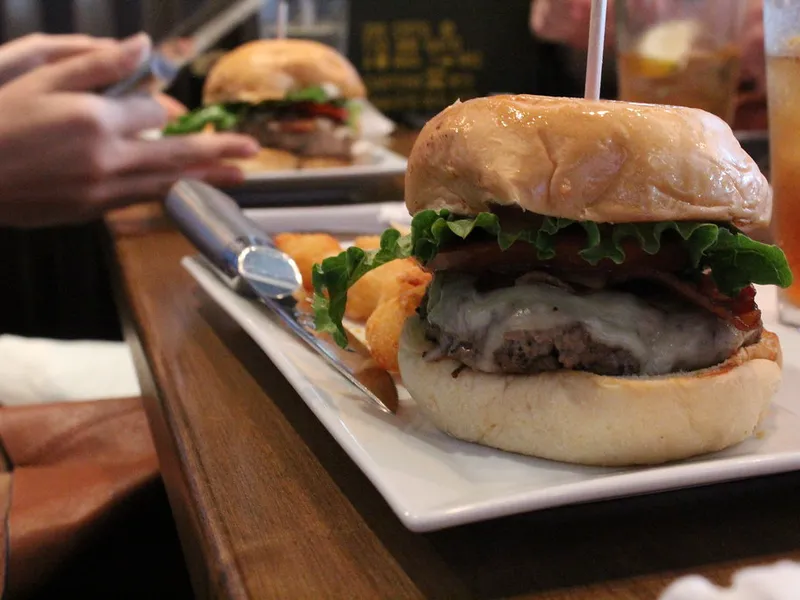 Four Cheese Garlic Bacon Burger at Burger Republic in Nashville, Tennessee, a cheeseburger with bacon and melted cheese on a bun