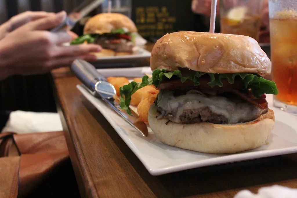 Four Cheese Garlic Bacon Burger at Burger Republic in Nashville, Tennessee, a cheeseburger with bacon and melted cheese on a bun