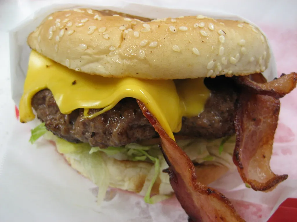 Thick dry-aged ribeye burger patty with melted cheese, Minetta Tavern Black Label New York