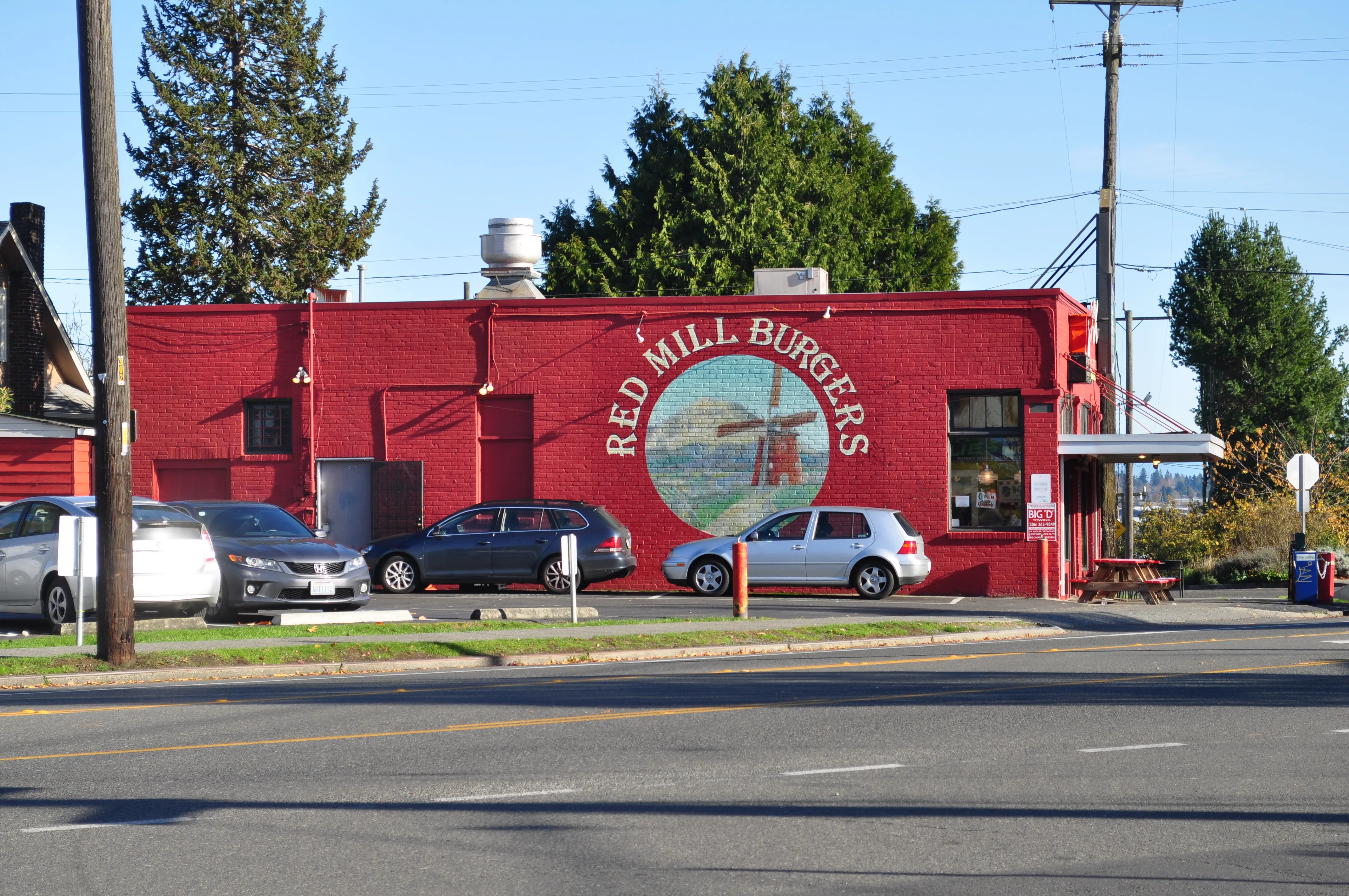 Red Mill Burgers in Phinney Ridge, Seattle: red brick burger restaurant with a painted windmill mural