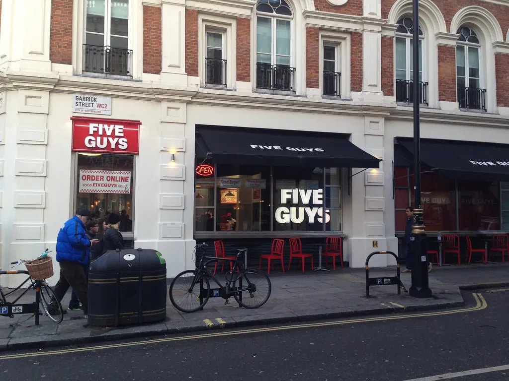 Five Guys Covent Garden storefront on Long Acre, London, the first Five Guys outside North America