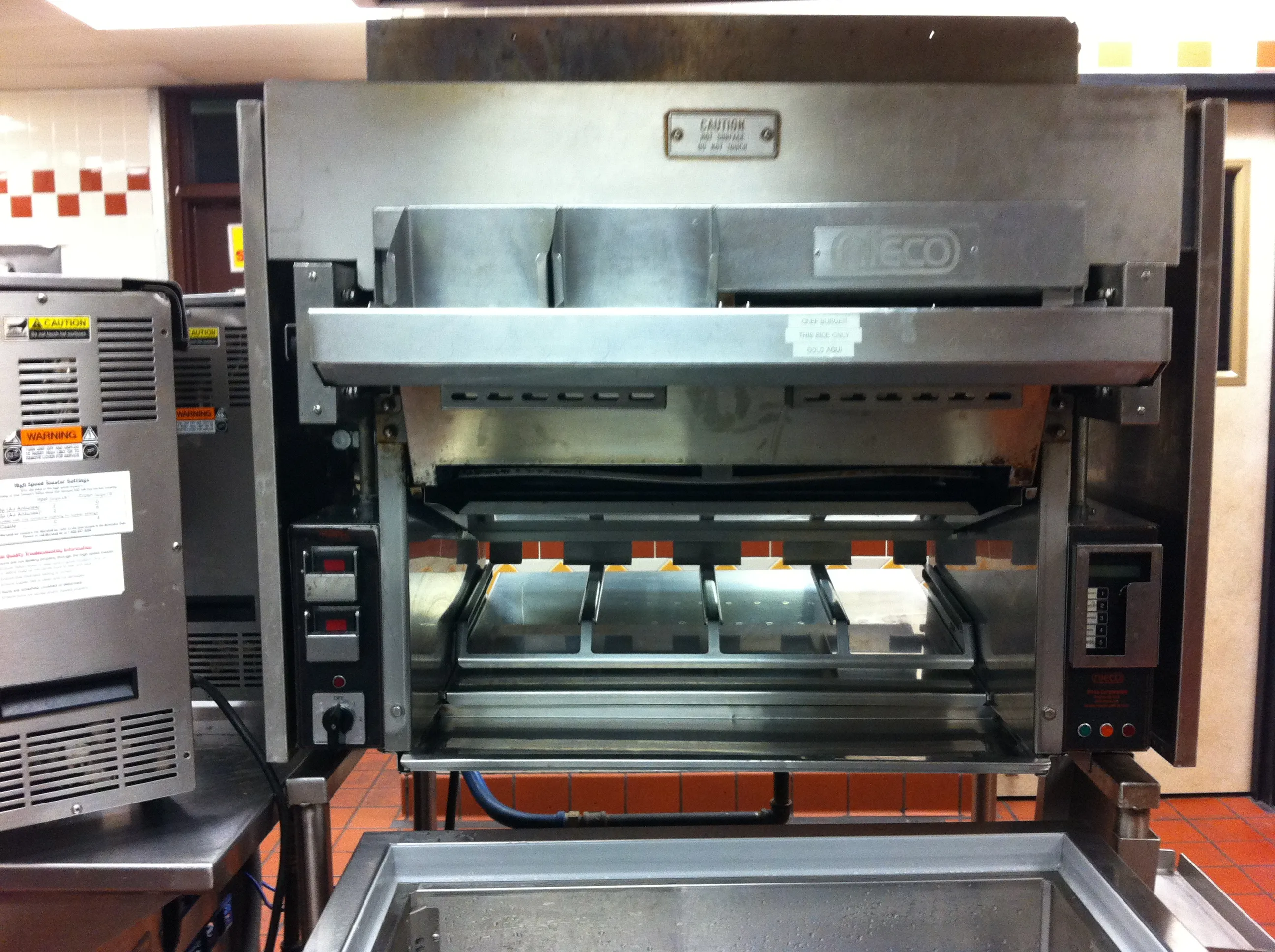 Nieco conveyor flame broiler of the type Burger King uses to flame-grill Whopper patties over gas burners