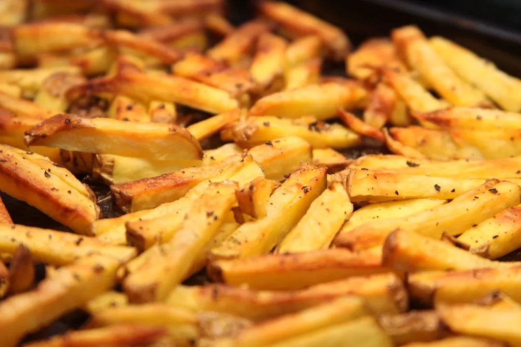 Close-up of golden french fries in value meal bundles