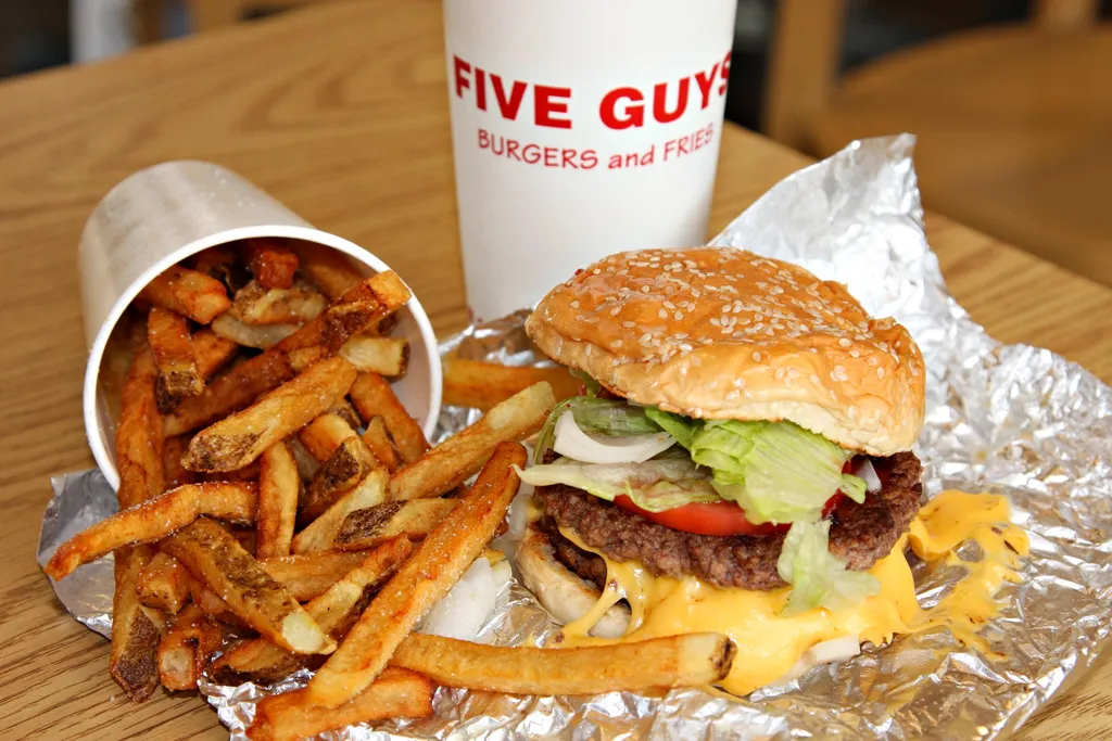 Five Guys burger and fries, the burger behind the BOGOBURGER National Cheeseburger Day 2026 deal