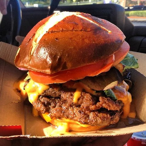 Wendy’s burger on a pretzel bun, the bun of the Pretzel Bacon Pub Cheeseburger that came back in 2026