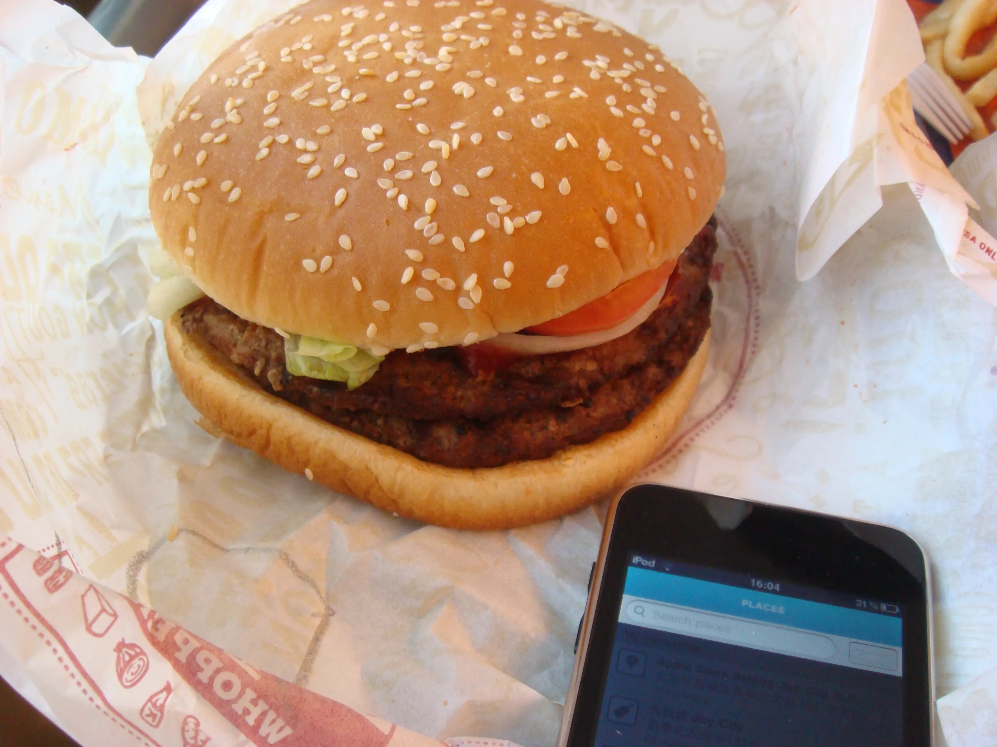 Burger King Double Whopper with two flame-grilled beef patties, lettuce and tomato on a sesame bun