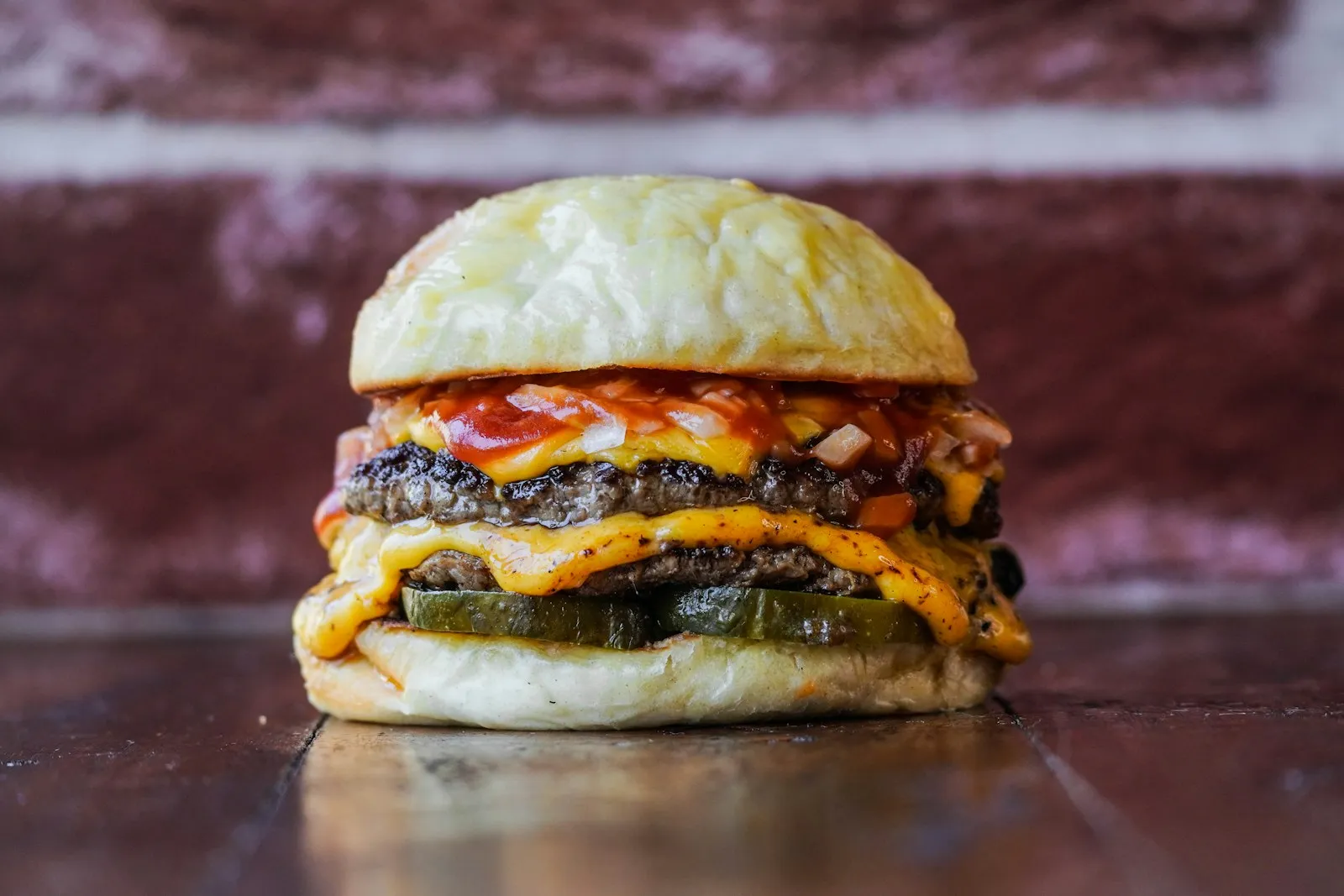 Double cheeseburger with 2 beef patties, melted American cheese, ketchup, diced onion and dill pickles