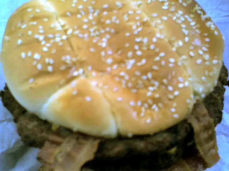 Hardee's Monster Thickburger with two charbroiled Angus patties, bacon and American cheese on a sesame bun, served in 2008
