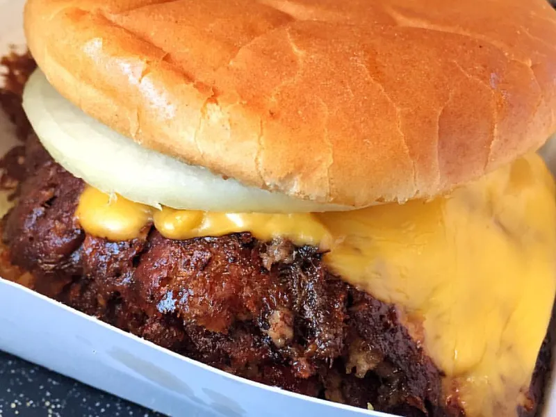 Triple meat Whataburger copycat triple-stack burger with mustard and pickles in a toasted 5-inch bun