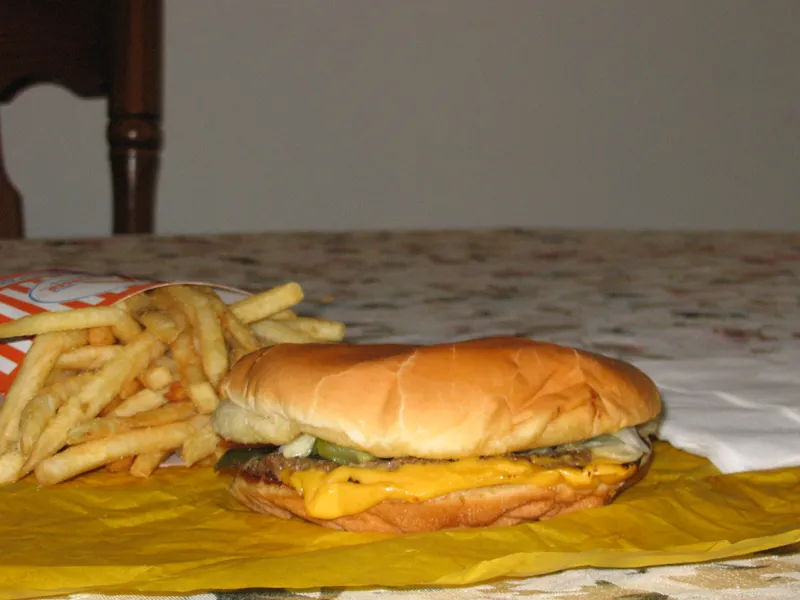 Whataburger with cheese, the Texas cheeseburger copied in this recipe: a wide thin patty with American cheese on a large toasted bun, with fries