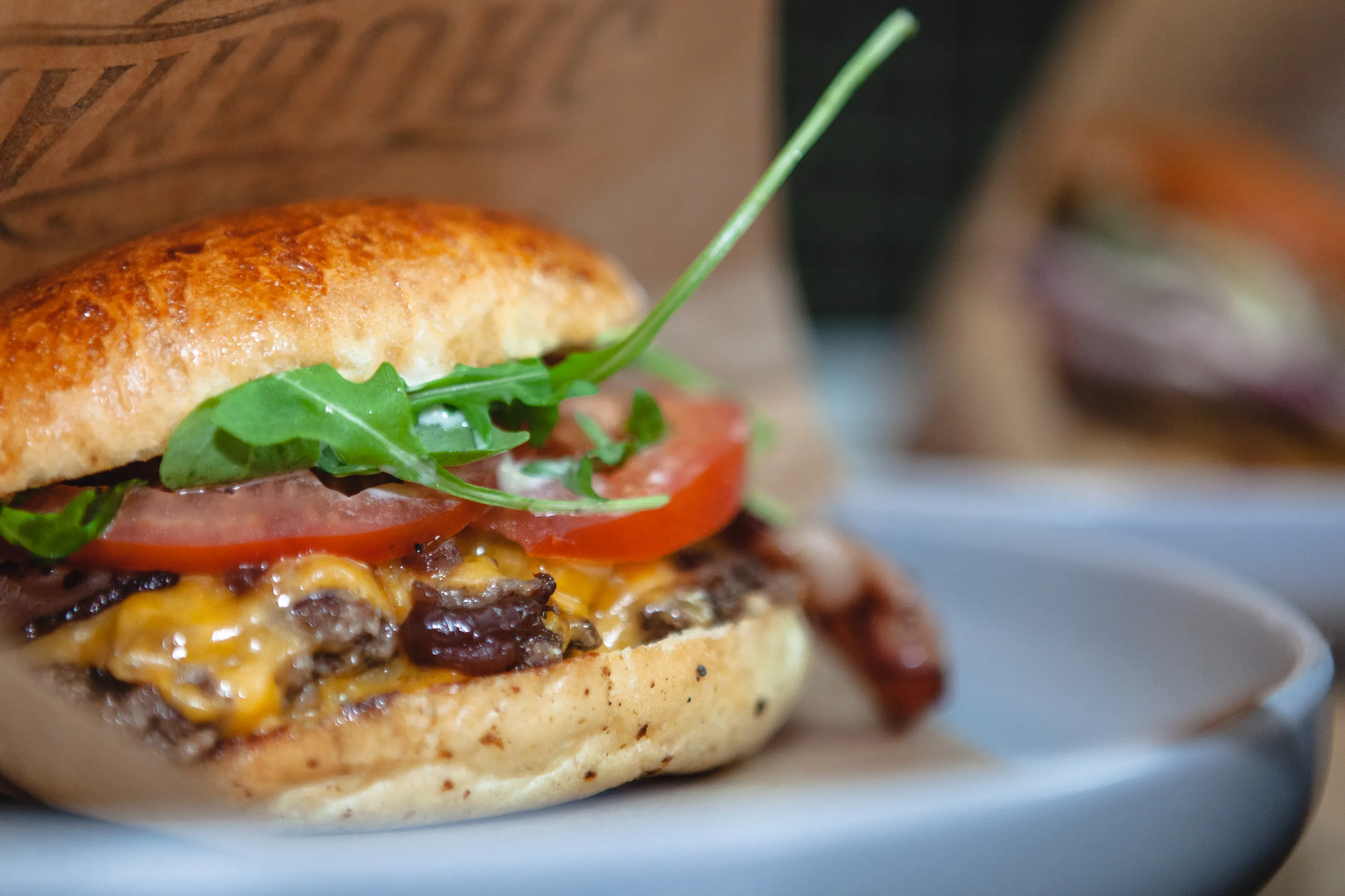 Close-up of a smash burger with crisp lacy patty edges, the style of Antwerp’s 2026 smashburger wave