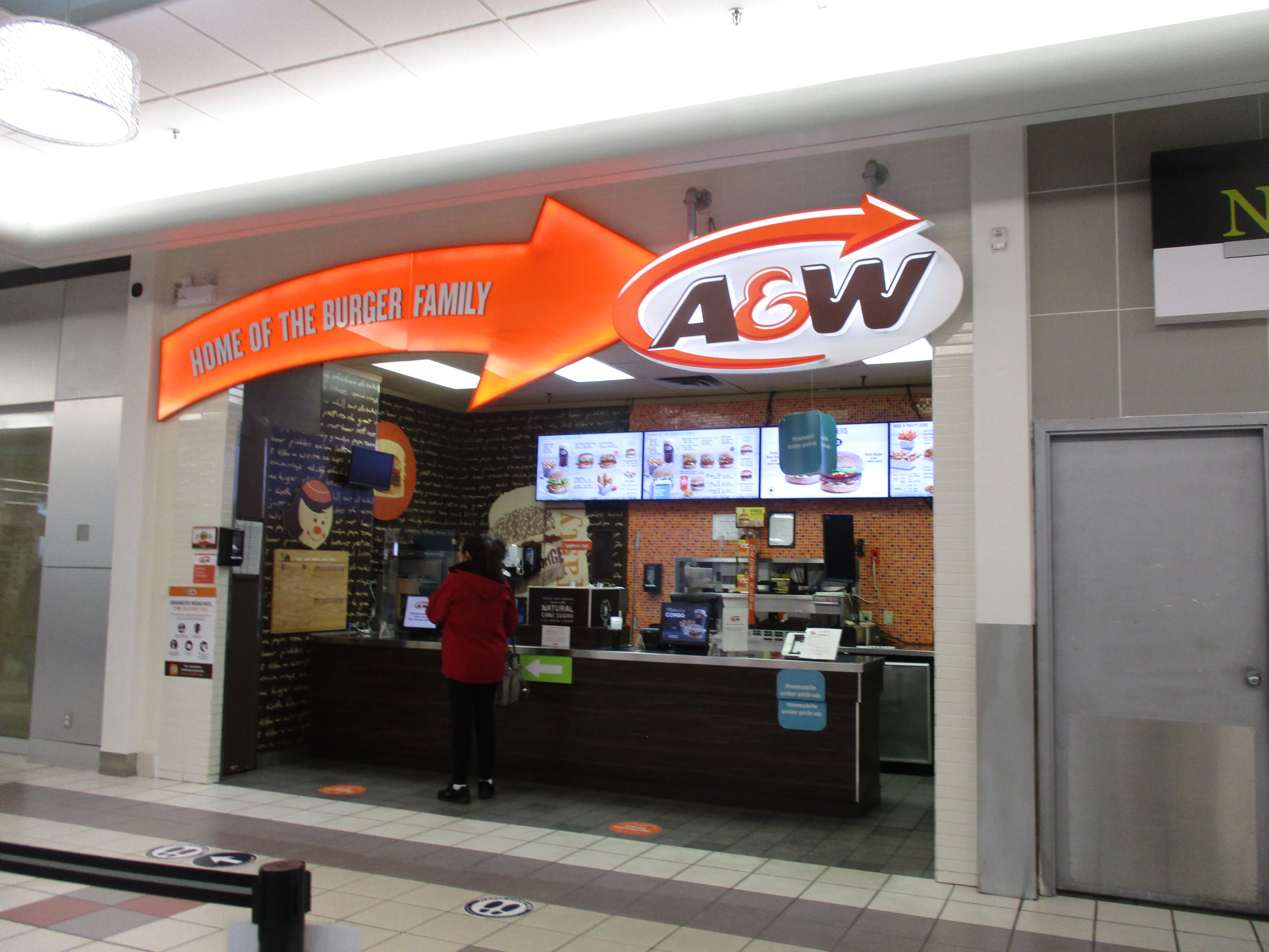 A&amp;W mall counter under the Home of the Burger Family sign with A&amp;W Canada menu boards, in Lloydminster, Alberta