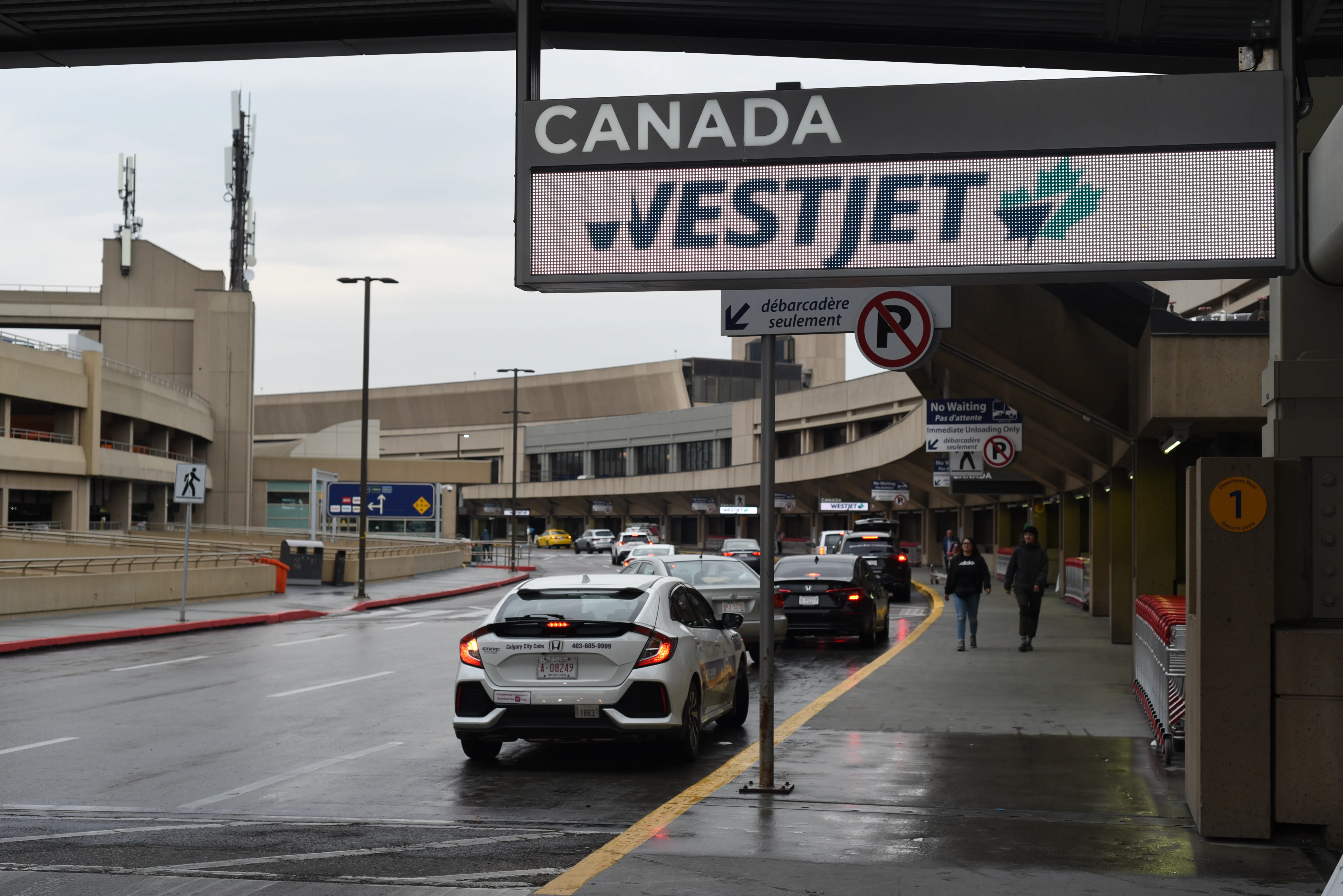 Departures curb at Calgary International Airport (YYC), where Yellow Pages lists an A&amp;W at 2000 Airport Road NE