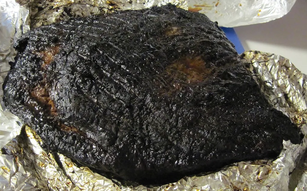 Smoked brisket sliced fresh off the smoker, like the 18-hour brisket in the 2080 Burger Black Mamba