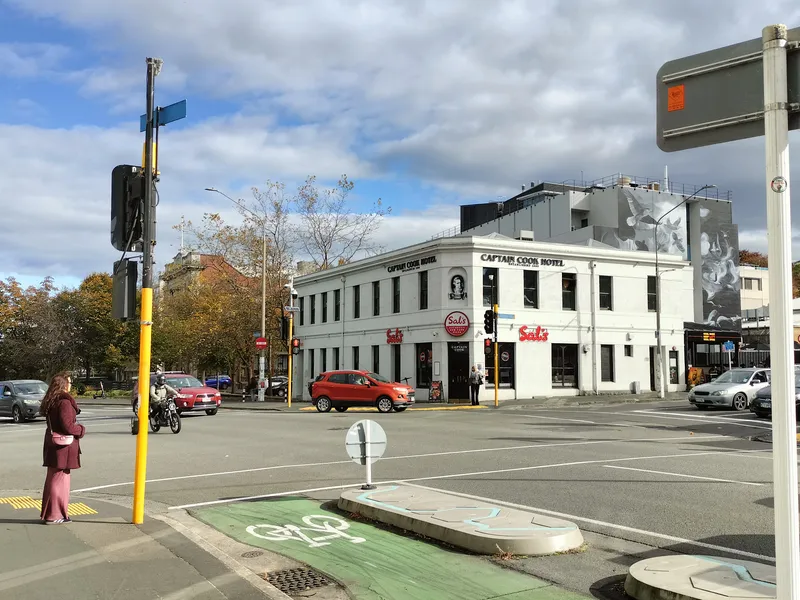 Great King Street in North Dunedin, the student quarter of BurgerFuel Dunedin, with the Captain Cook Hotel and Sal's Pizza on the Albany Street corner