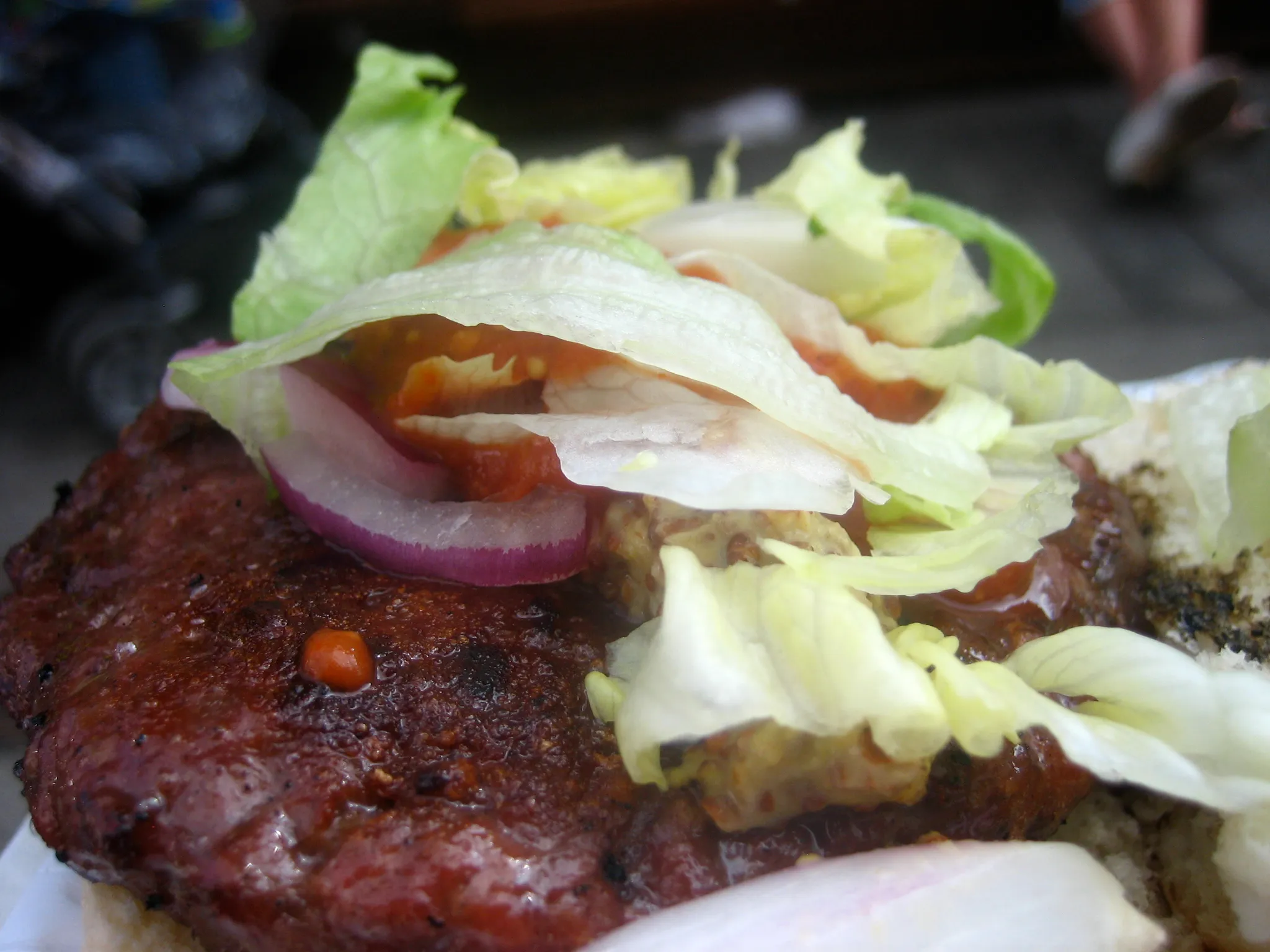 Venison burger on a brioche bun, similar to Le Chasseur, the seasonal burger at Denise’s in Geneva