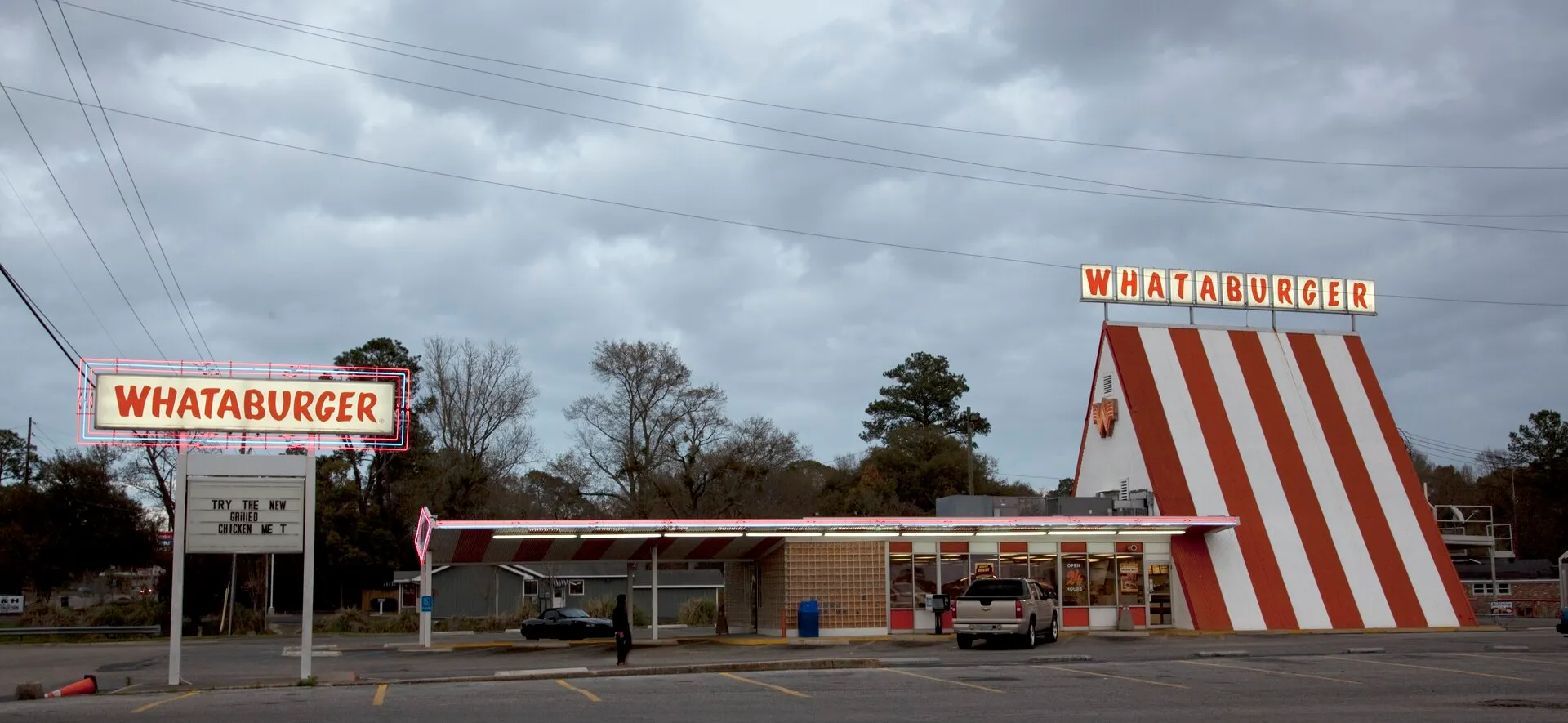 Orange-and-white striped A-frame Whataburger building, the chain’s signature design since 1961