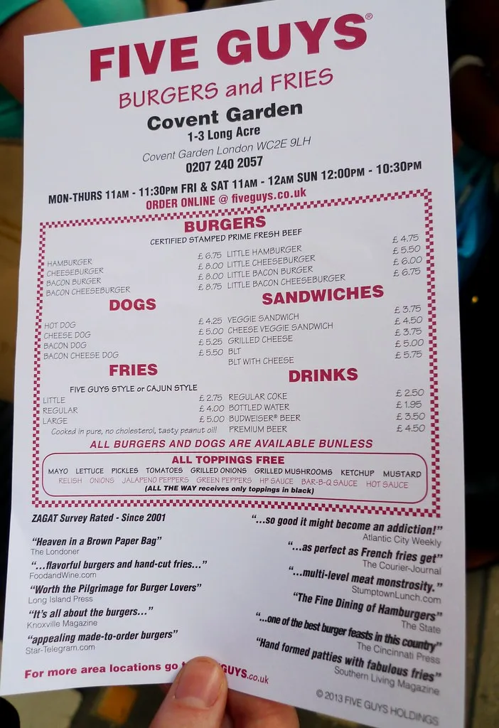 Five Guys London menu board at the Covent Garden restaurant in July 2013, listing burgers, hot dogs, fries and drinks