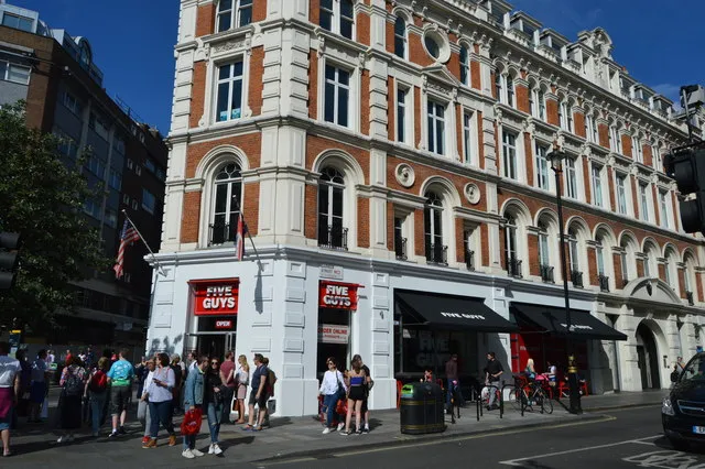 Five Guys London Covent Garden shopfront at 1-3 Long Acre, WC2E 9LH, the first Five Guys burger restaurant in the UK