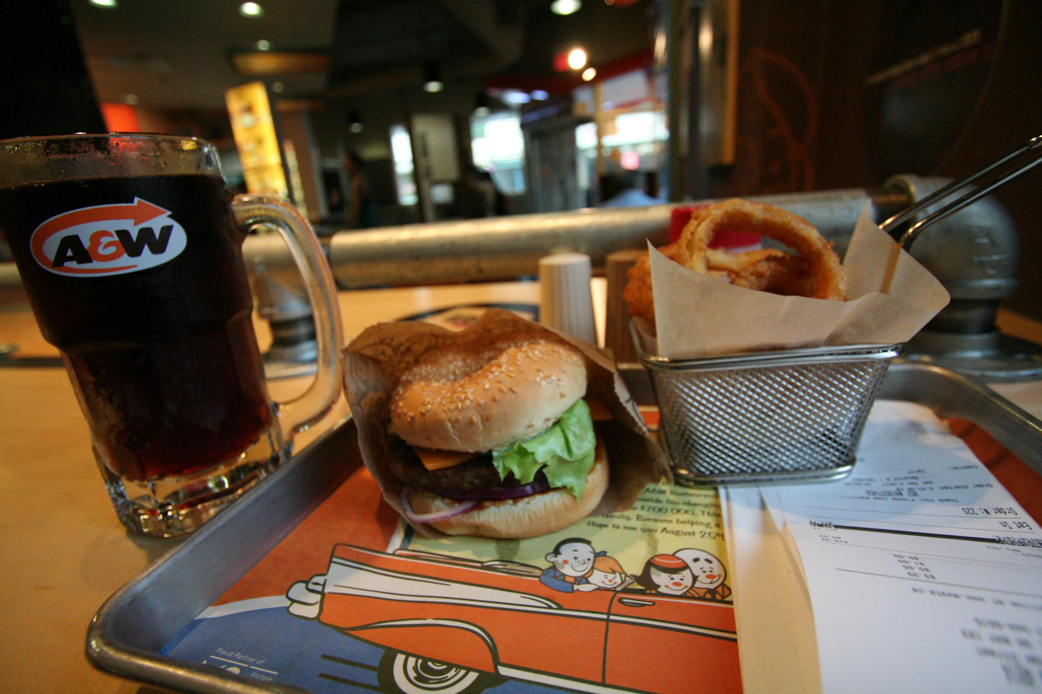 A&amp;W Canada tray with a burger, onion rings and a mug of A&amp;W Root Beer