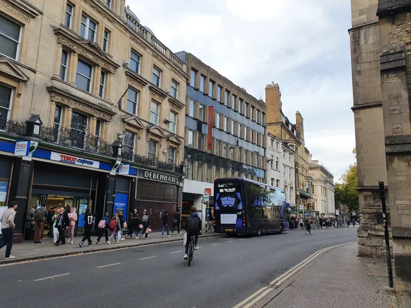 Magdalen Street in Oxford city centre, where Five Guys Oxford occupies the ground floor of Oxenford House at 13-15 Magdalen Street, OX1 3AE