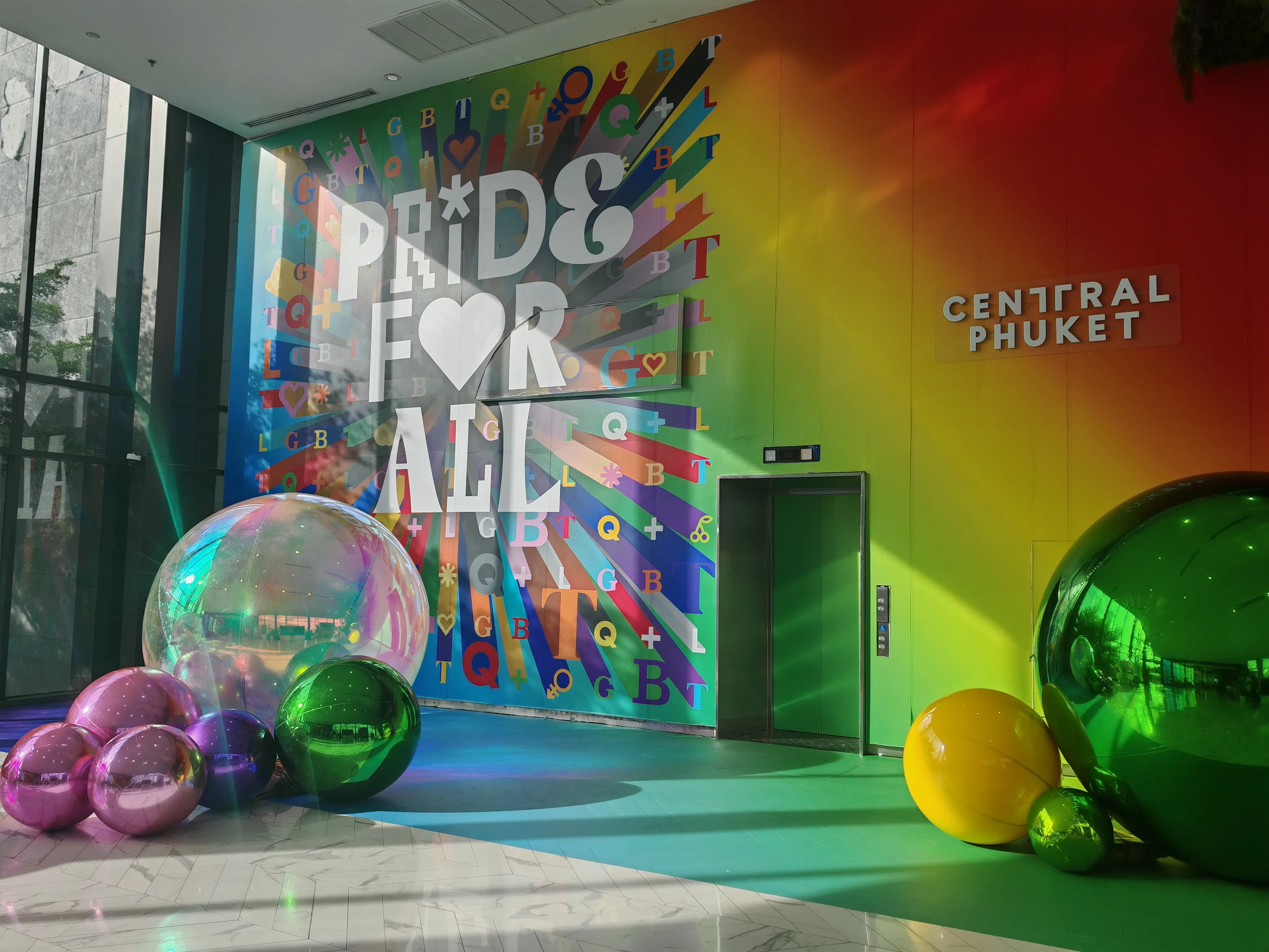 Lobby of the Central Phuket shopping mall, home to a Prime Burger Phuket branch, decorated for Pride in June 2024