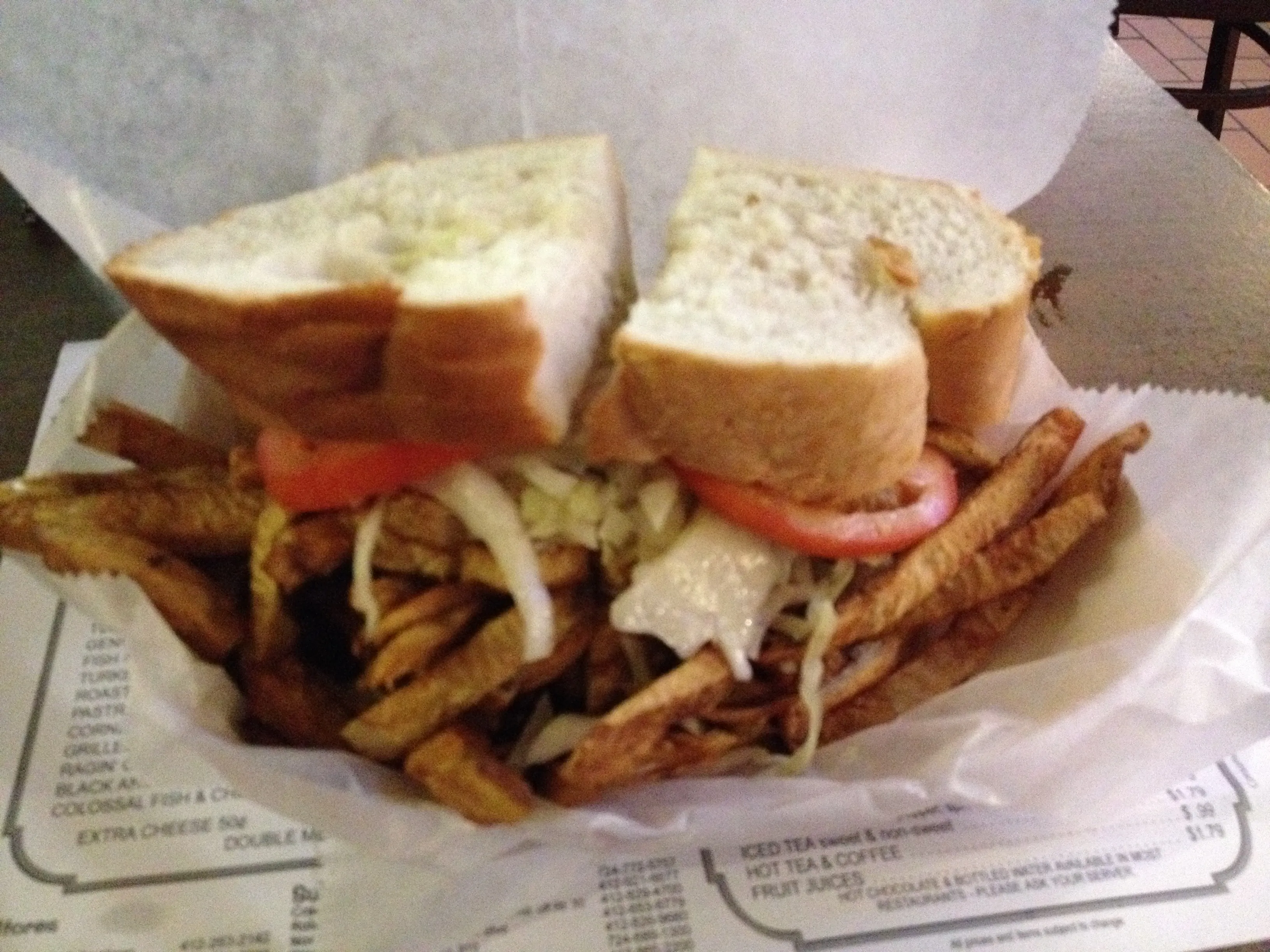 Primanti Bros. sandwich in Pittsburgh with fries and coleslaw stacked inside