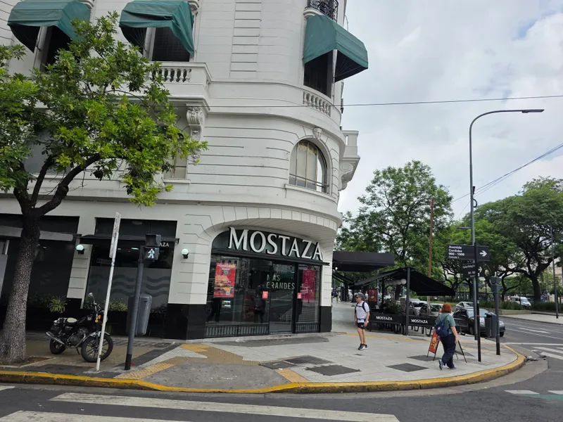 Mostaza burger restaurant storefront on a Buenos Aires street corner, the Argentine chain with at least eight branches in Mendoza