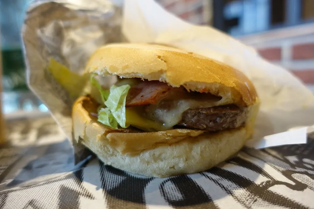 A made-to-order 231 East Street cheeseburger with fries at the Paris Montparnasse franchise