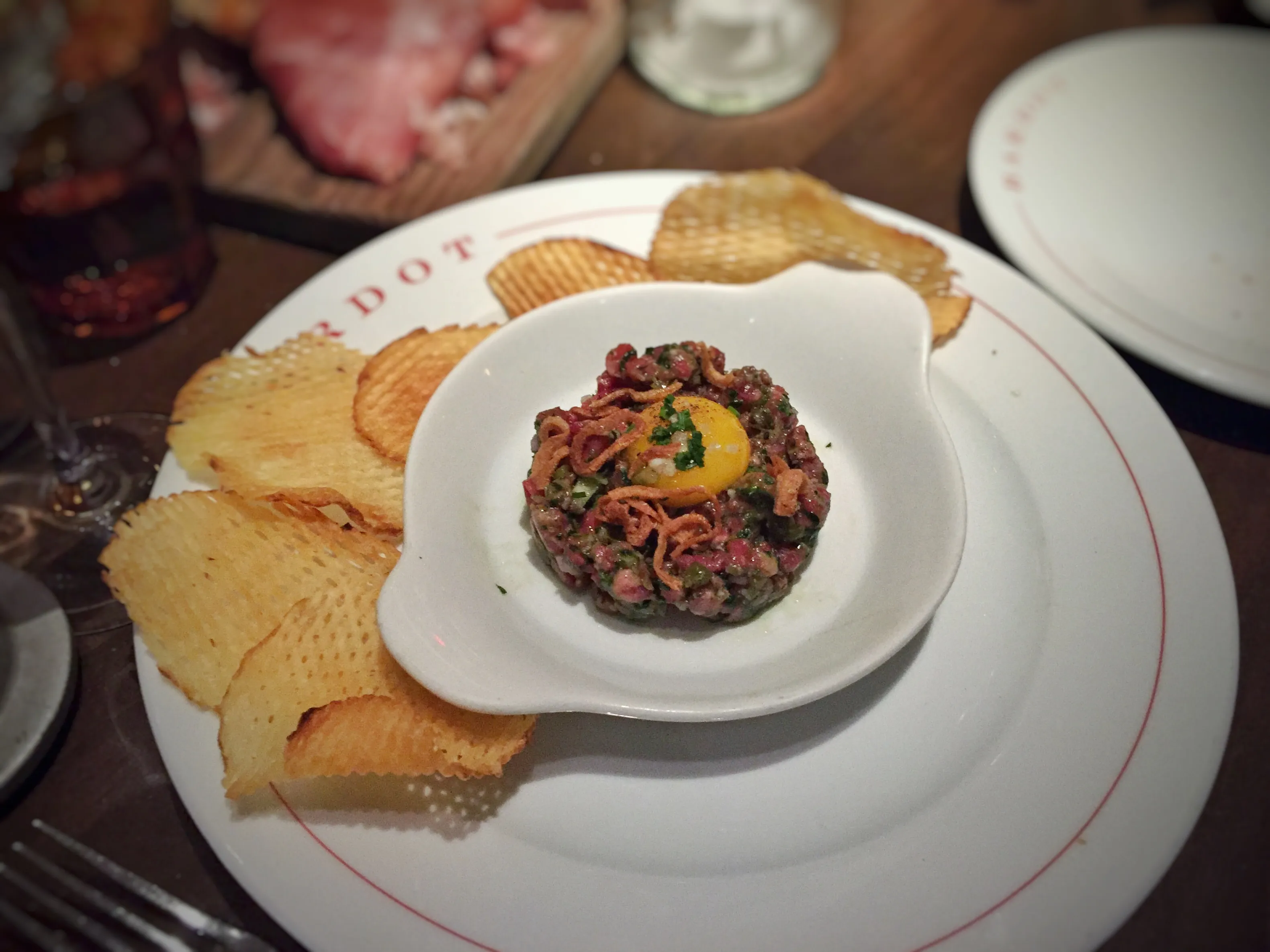 Plate of beef tartare illustrating the raw base of AnnaLena’s deconstructed Cheeseburger 2050 tasting course (not AnnaLena’s dish)