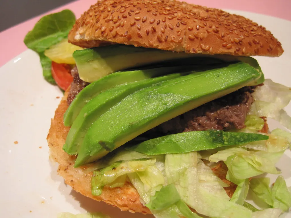 Avocado cheeseburger cut open showing avocado and melted cheese at MUNCH’S Burger Shack Tokyo